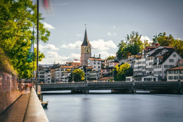 a bridge over a river with buildings on either side of it